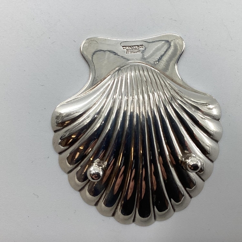 48 - A collection of Sterling silver and white metal items to include a scallop shaped dish by Tiffany & ... 