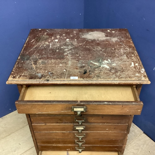 484 - A Vintage narrow filing chest of 9 drawers, bearing label to bottom section: Percy Jones Ltd, 69cmW ... 