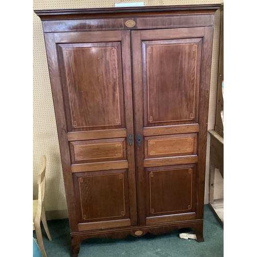 488 - A mahogany and string inlay decoration, two door linen press with added shelves built in to interior... 