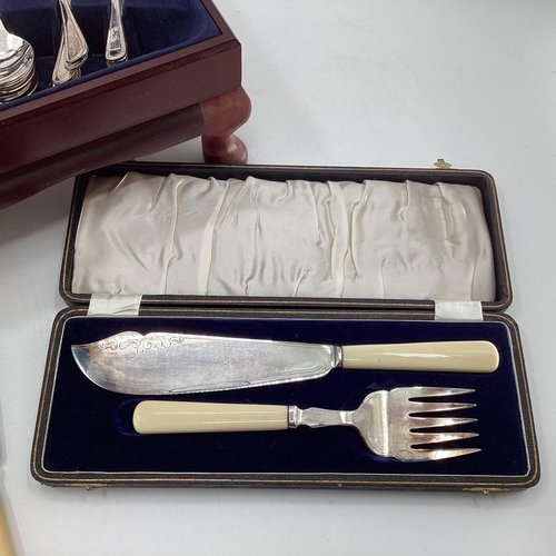 52 - A boxed canteen of electro plated cutlery together with a boxed plated fish server