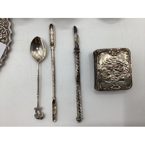 54 - A South Asian white metal condiment set and tray together with other similar items