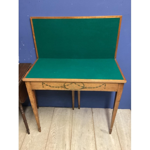 542 - Small mahogany two tier buffet with drawer below, on wheels, and a fold over table, a fall flap occa... 