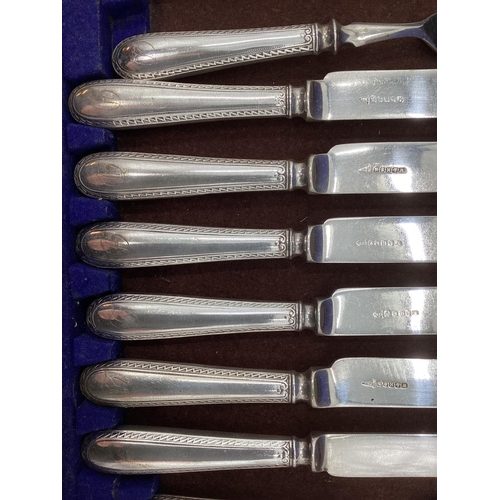 55 - A boxed canteen of white metal cutlery