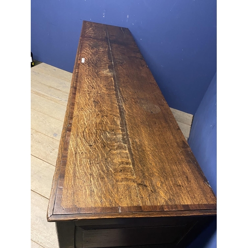 558 - A good oak dresser base, with four drawers and brass handles, 216 x 51cm, some wear and old splits e... 