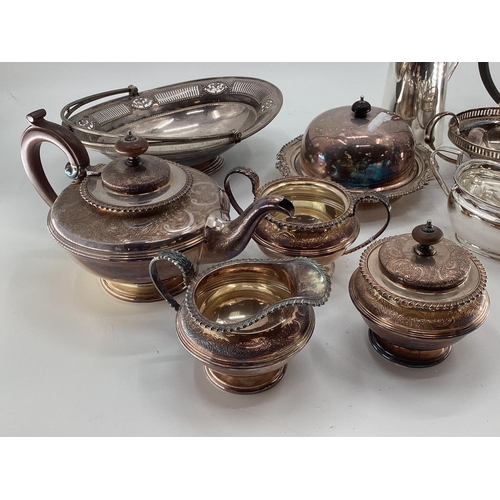 56 - A collection of electroplated wares, to include tea pots, jugs etc