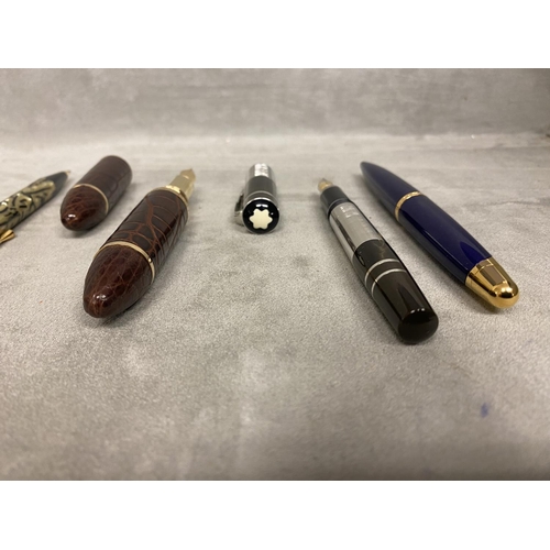 64 - A collection of Fountain Pens, to include Louis Vuitton, 3 Mont Blancs and others, in a presentation... 