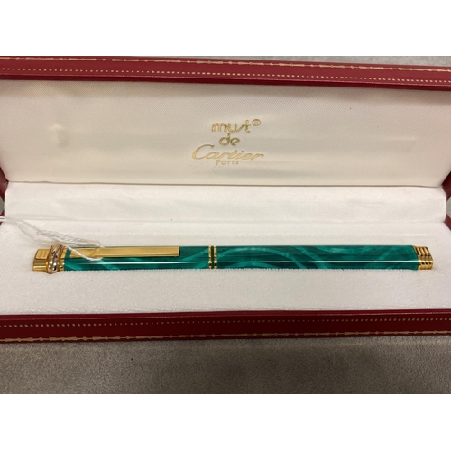 7 - A Must de Cartier gold plated and faux malachite ball point pen, box and papers