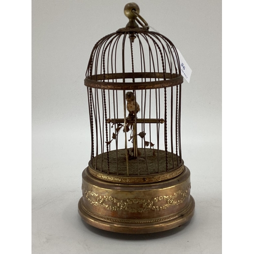 95 - A Continental early C20th bird case Automaton, Clockwork mechanism, with gilt brass base, 28cmH