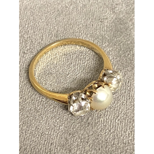 3 - An unmarked yellow and white metal pearl and diamond ring, central button pearl with old cut diamond... 