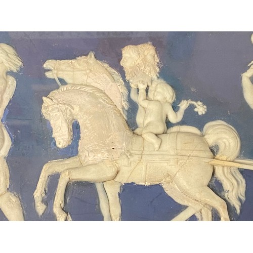 100 - A Wedgwood Plaque, blue and white , in a gilt glazed frame, mounted, 27.5 x 42cm, see images