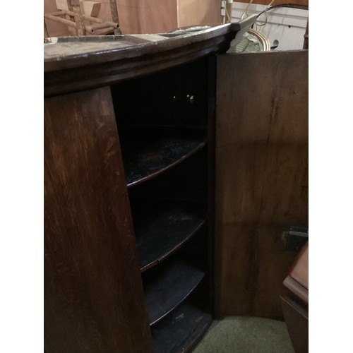 509 - Two corner cabinets one oak, one mahogany, as found