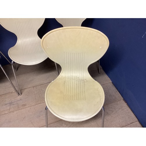 517 - A set of four mid C20th plastic chairs 81cm H