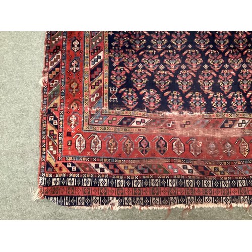 701 - Small Persian style rug runner, with blue and red and all over geometric design, with central panel ... 