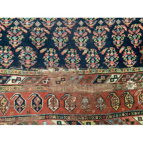 701 - Small Persian style rug runner, with blue and red and all over geometric design, with central panel ... 