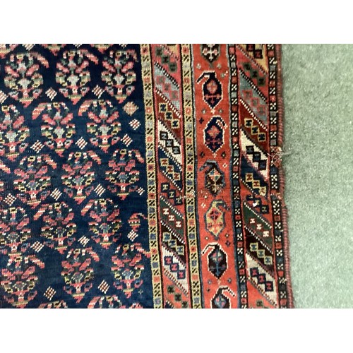 701 - Small Persian style rug runner, with blue and red and all over geometric design, with central panel ... 