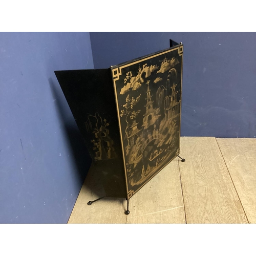 176 - A decorative, Mid century fire screen, in the oriental taste with images of pagodas, open 82cm W x 6... 