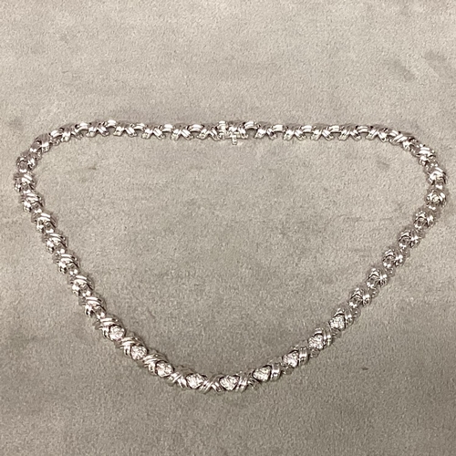 1 - Tiffany & Co., An 18ct white gold and diamond necklace, circa 1999, possibly by Elsa Peretti, Knot l... 