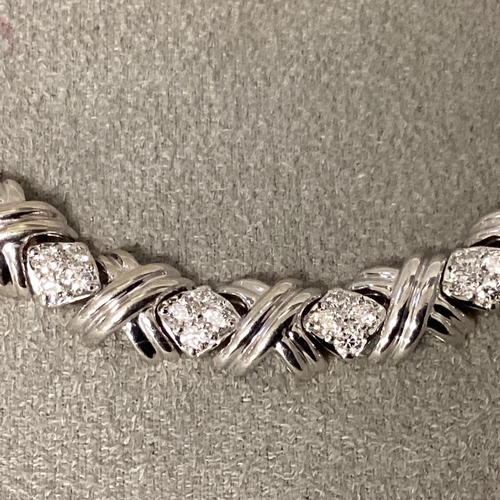 1 - Tiffany & Co., An 18ct white gold and diamond necklace, circa 1999, possibly by Elsa Peretti, Knot l... 