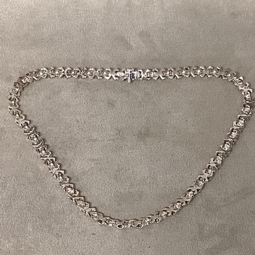 1 - Tiffany & Co., An 18ct white gold and diamond necklace, circa 1999, possibly by Elsa Peretti, Knot l... 