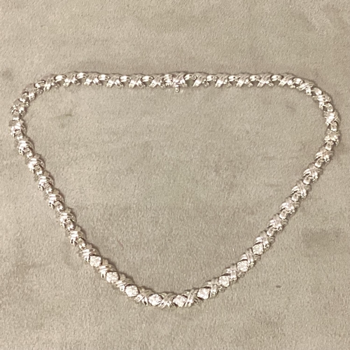 1 - Tiffany & Co., An 18ct white gold and diamond necklace, circa 1999, possibly by Elsa Peretti, Knot l... 