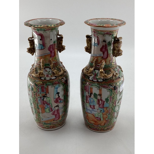 101 - A pair of small late C19th/early C20th Chinese Famille Rose Baluster vases, gilt decoration with han... 