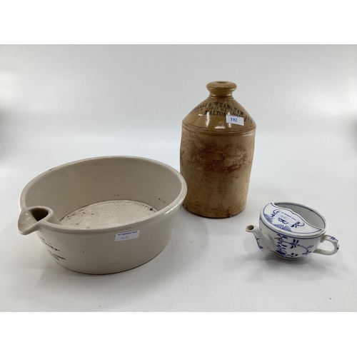 102 - Two stoneware items, flask marked Russells and Wrangham Ltd, Malton and The Cream Sep, and a blue an... 