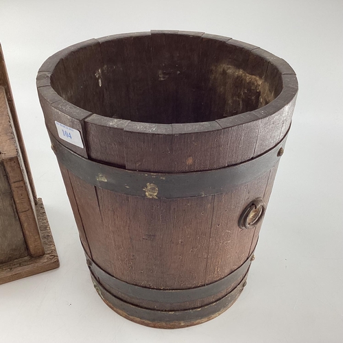 104 - An oak candle box with trefoil cut out, 40cmH, and a brass bound copered bucket 28cmH