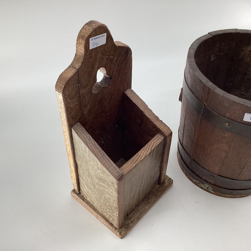 104 - An oak candle box with trefoil cut out, 40cmH, and a brass bound copered bucket 28cmH