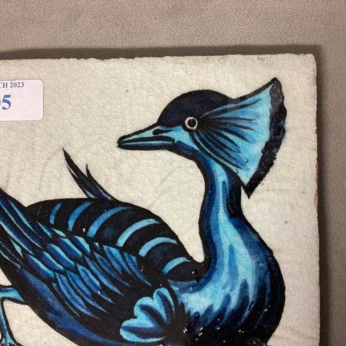 105 - WILLIAM DE MORGAN, A blue and white tile of a stylised bird, stamped verso W DE MORGAN, 15.5 x 15.5c... 