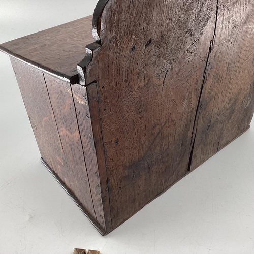 106 - An oak hanging candle box, with single drawer, below containing a mixed selection of cigars, Davidof... 