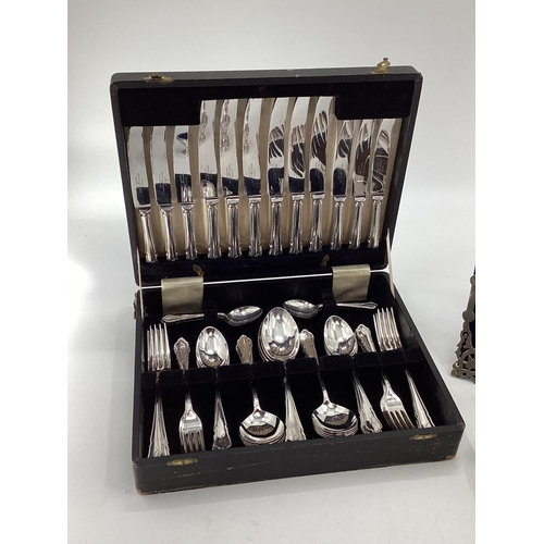 12 - Collection of electroplated and white metal items to include a pierced picture frame, cutlery and ot... 