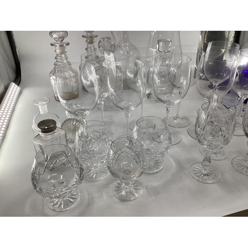 123 - Large collection of C20th glassware to include decanters, large wine glasses etc