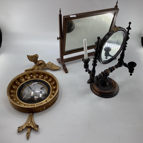 132 - Gilt wood convex mirror topped by a carved eagle, with 2 other mirrors