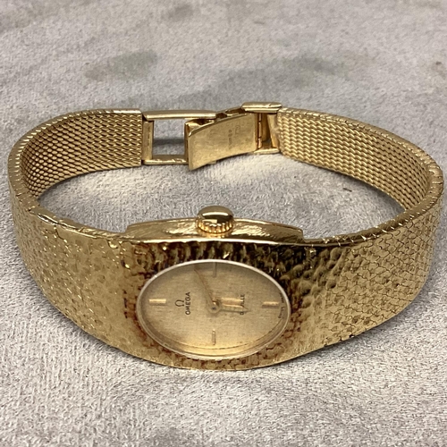 14 - A ladies 18ct gold OMEGA DE VILLE Wristwatch, Oval 14mm x 12mm gold face with gold batons at points ... 