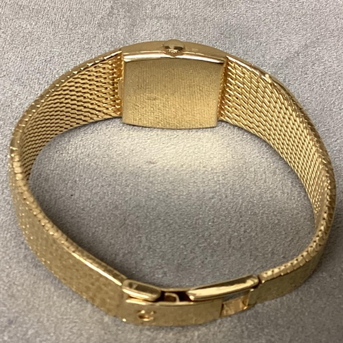 14 - A ladies 18ct gold OMEGA DE VILLE Wristwatch, Oval 14mm x 12mm gold face with gold batons at points ... 