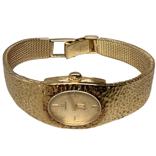 14 - A ladies 18ct gold OMEGA DE VILLE Wristwatch, Oval 14mm x 12mm gold face with gold batons at points ... 