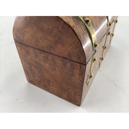 149 - Walnut and brass bound dome topped tea caddy, 24 x 18 x 12cm