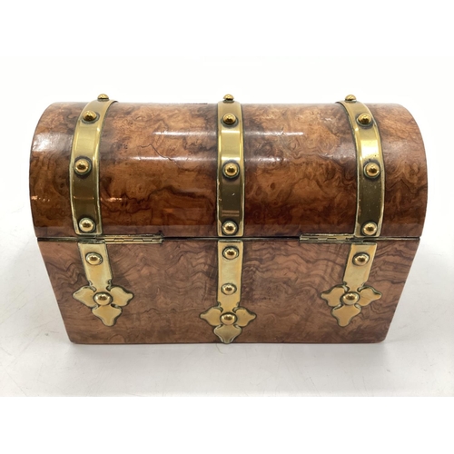 149 - Walnut and brass bound dome topped tea caddy, 24 x 18 x 12cm