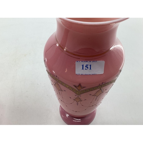 151 - Pair of early C20th pink vases with gilt decoration and circular foot 30c,