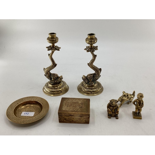 152 - Collection of brass items to include a pair of stylised dolphin candlesticks etc