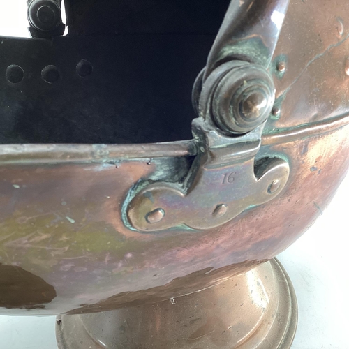 154 - A Helmet shaped copper coal scuttle