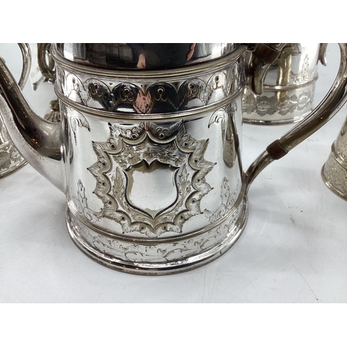 17 - A silver plated five piece tea set with ornate decoration, Bacchus mask spouts engraved to jugs with... 