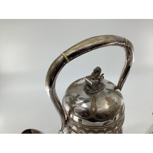 17 - A silver plated five piece tea set with ornate decoration, Bacchus mask spouts engraved to jugs with... 