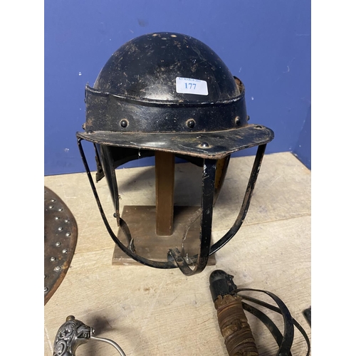 177 - A reproduction/reinactment , Lobster pot helmet on stand, together with studded kettle helmet, tunic... 