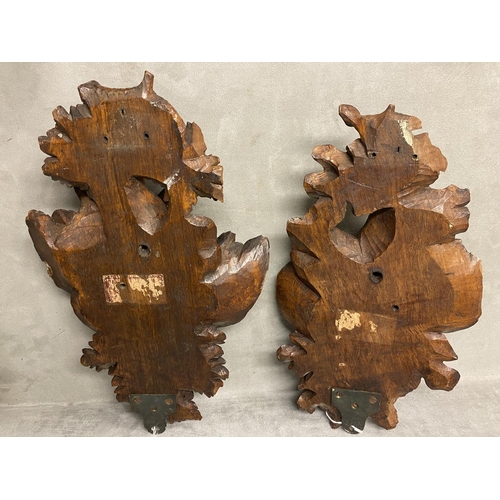 178 - A pair of carved wooden wall sconces , each depicting a pair of game birds on an oak branch, each ap... 