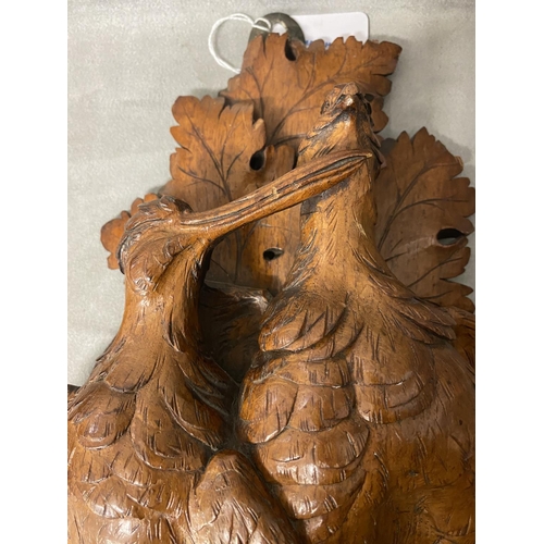 178 - A pair of carved wooden wall sconces , each depicting a pair of game birds on an oak branch, each ap... 