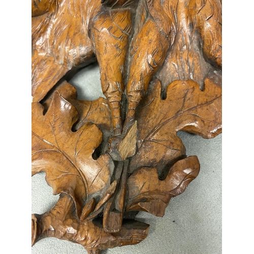 178 - A pair of carved wooden wall sconces , each depicting a pair of game birds on an oak branch, each ap... 