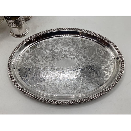 18 - A collection of silver plated wares to include a Campana style wine cooler, a 3 piece tea set and a ... 