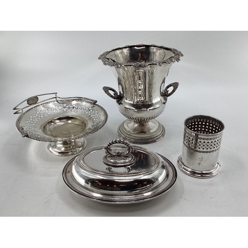 18 - A collection of silver plated wares to include a Campana style wine cooler, a 3 piece tea set and a ... 