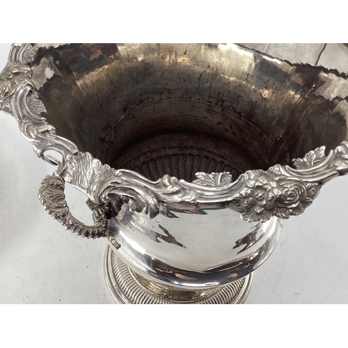 18 - A collection of silver plated wares to include a Campana style wine cooler, a 3 piece tea set and a ... 